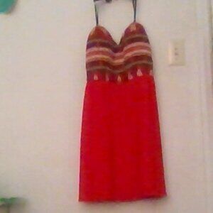 Bright neon dress with patterns on the top.